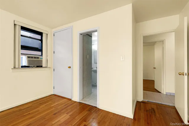 a view of hallway with wooden floor