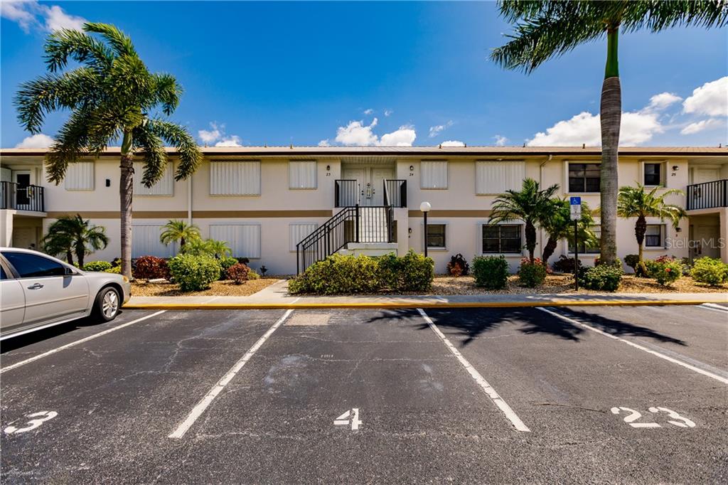26485 Rampart Boulevard, Unit B4 Punta Gorda, FL 33983 - Photo 1 of 1 a view of a patio with swimming pool table and chairs