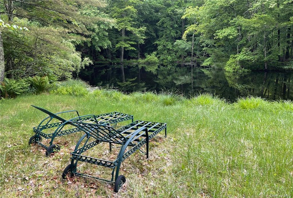 a view of a chairs and table in the river