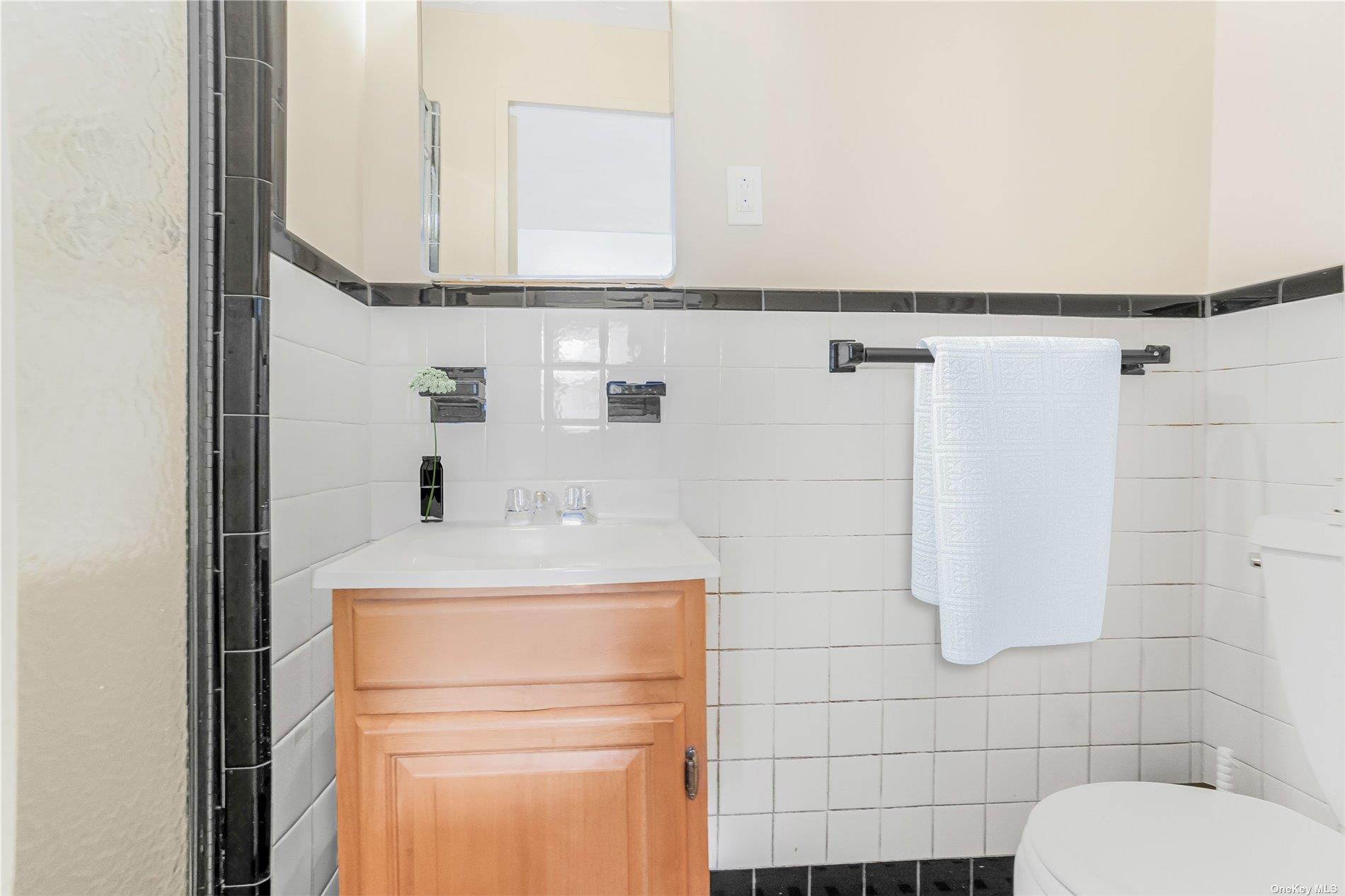98-22 63rd Drive, Unit 5E Queens, NY 11374 - Photo 11 of 15 a bathroom with a sink toilet and shower