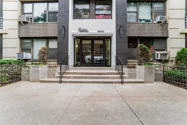 a view of brick building with large windows