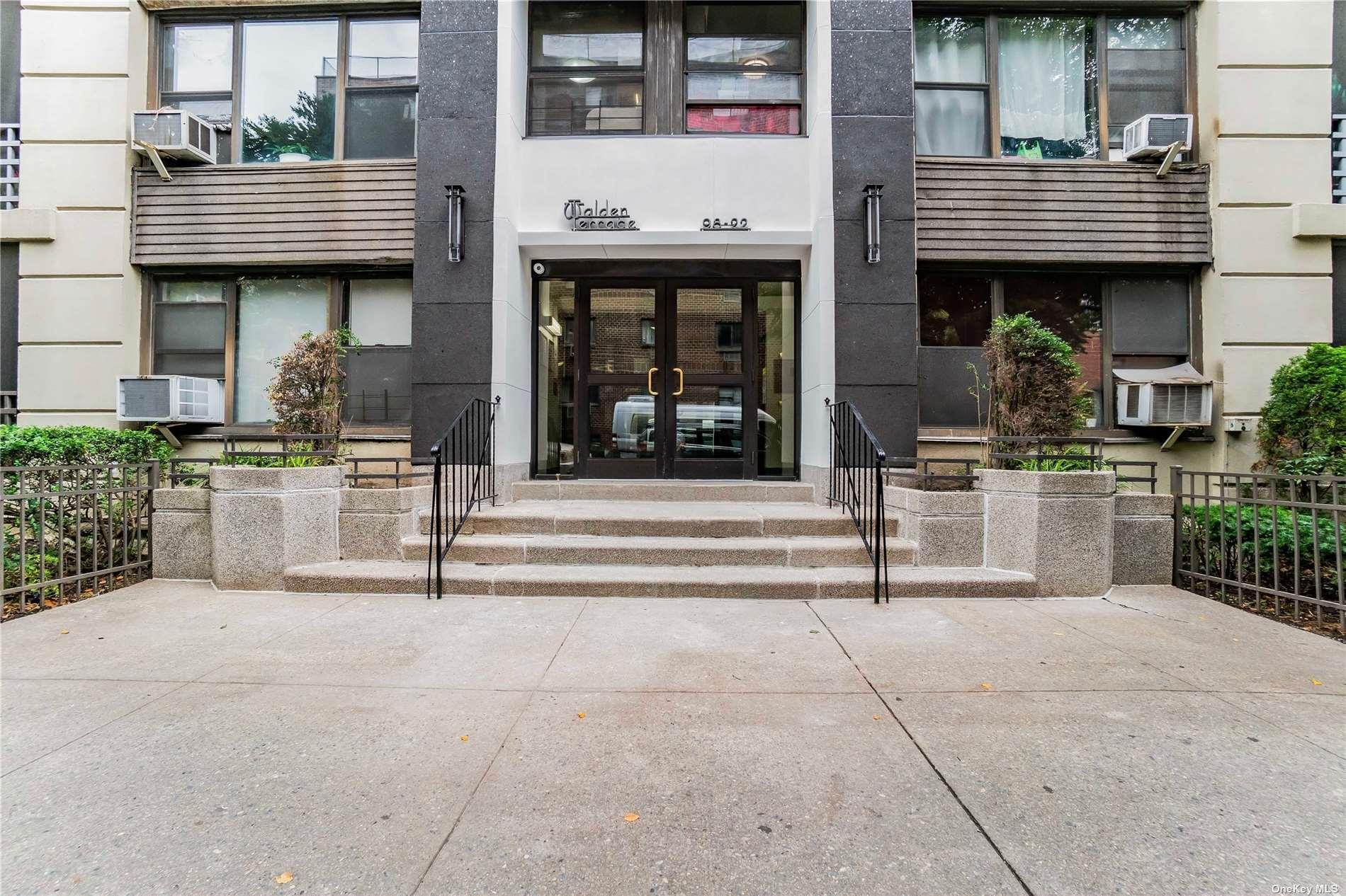 98-22 63rd Drive, Unit 5E Queens, NY 11374 - Photo 14 of 15 a view of brick building with large windows