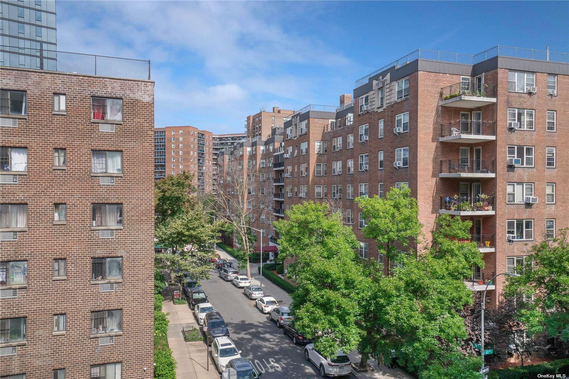 98-22 63rd Drive, Unit 5E Queens, NY 11374 - Photo 2 of 15 a view of a tall building