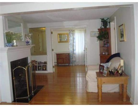 114 North Ridge Road Ipswich, MA 01938 - Photo 8 of 16 a living room with furniture and a fireplace