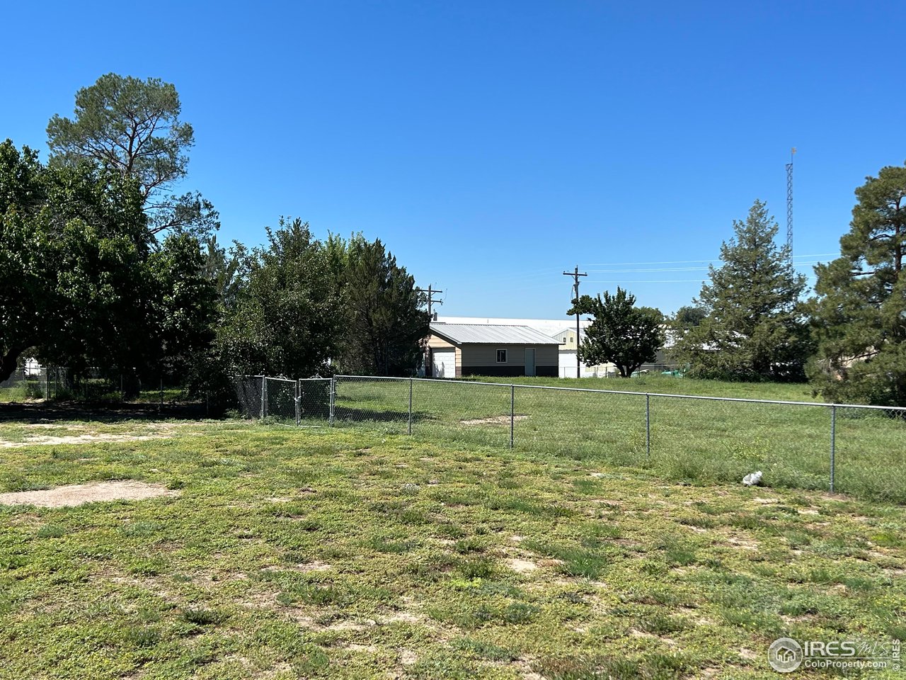 207 Dickson Street Wiggins, CO 80654 - Photo 3 of 9 a view of a house with a yard
