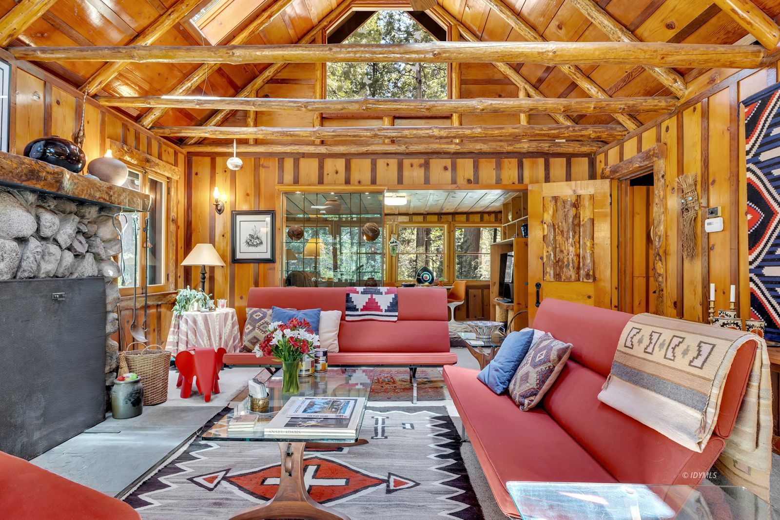 25100 Indian Rock Road Idyllwild, CA 92549 - Photo 16 of 75 a living room with furniture a city view and a large window