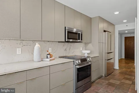 a bedroom with a bed and cabinets