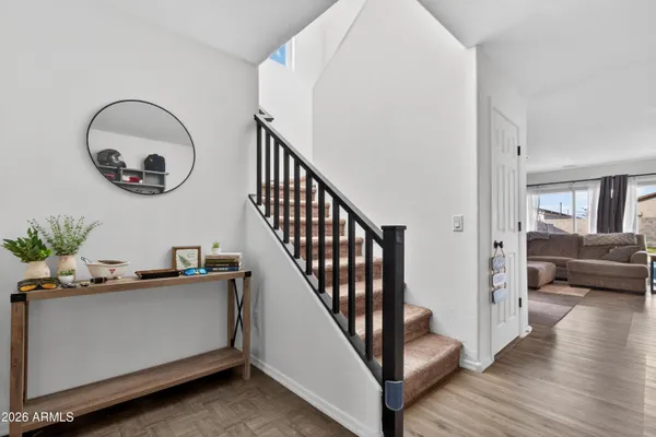 a kitchen with granite countertop wooden cabinets a refrigerator a stove a sink and a microwave