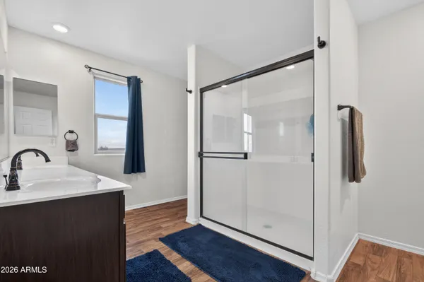 a view of an entryway with wooden floor