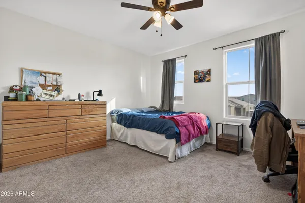 a bathroom with a double vanity sink mirror and shower