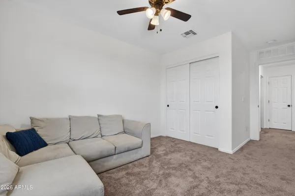 a bedroom with a bed and a couch