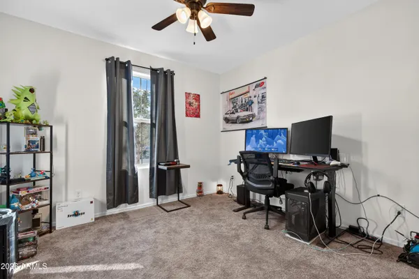 a bathroom with a sink a toilet and shower curtain