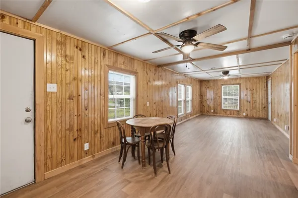 a view of a dining room with furniture window and wooden floor