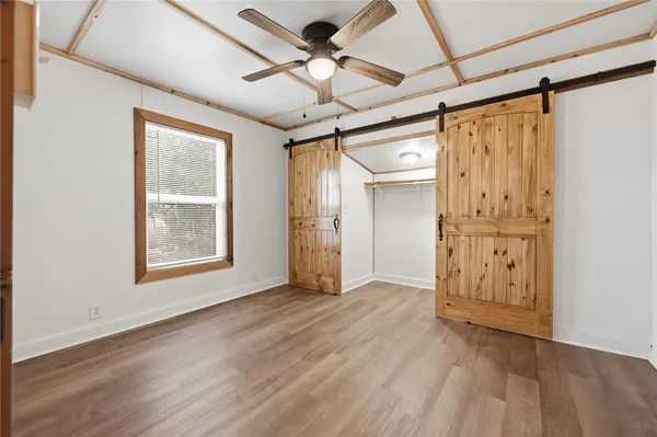 a view of an empty room with a window