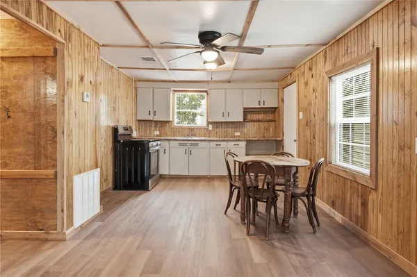 a view of a dining room with furniture window and wooden floor