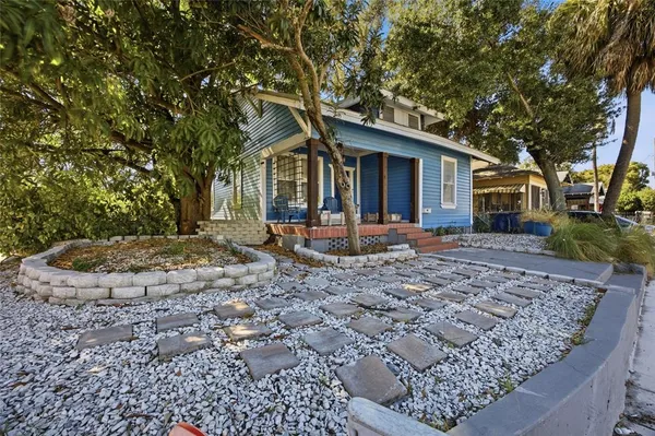 a front view of a house with a yard patio and fire pit