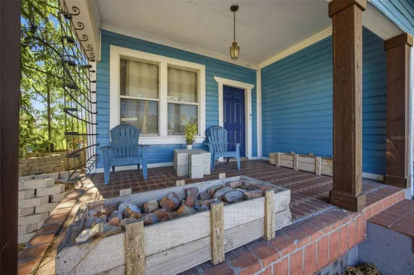 a outdoor space with patio the couches and a potted plant