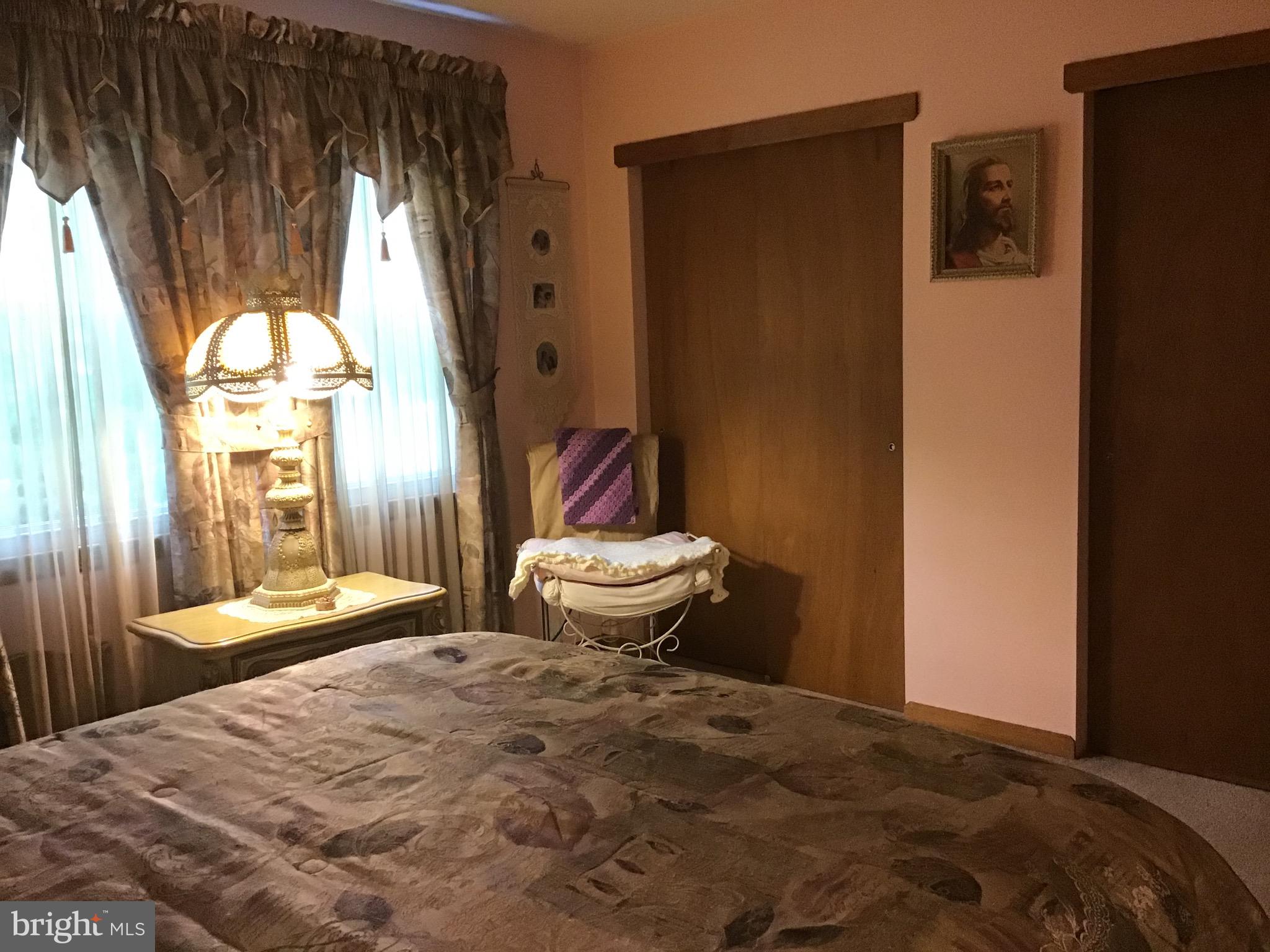 1503 Marshall Mill Road Franklinville, NJ 08322 - Photo 21 of 34 a bedroom with a bed and a dresser