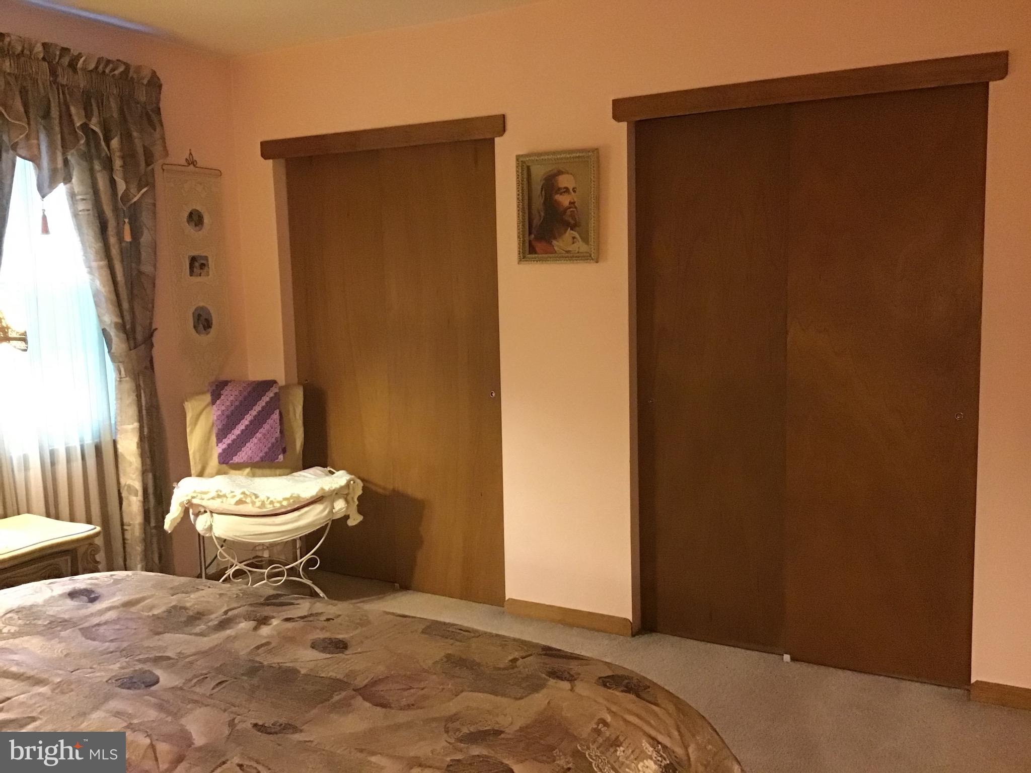 1503 Marshall Mill Road Franklinville, NJ 08322 - Photo 23 of 34 a bathroom with a toilet and a shower curtain