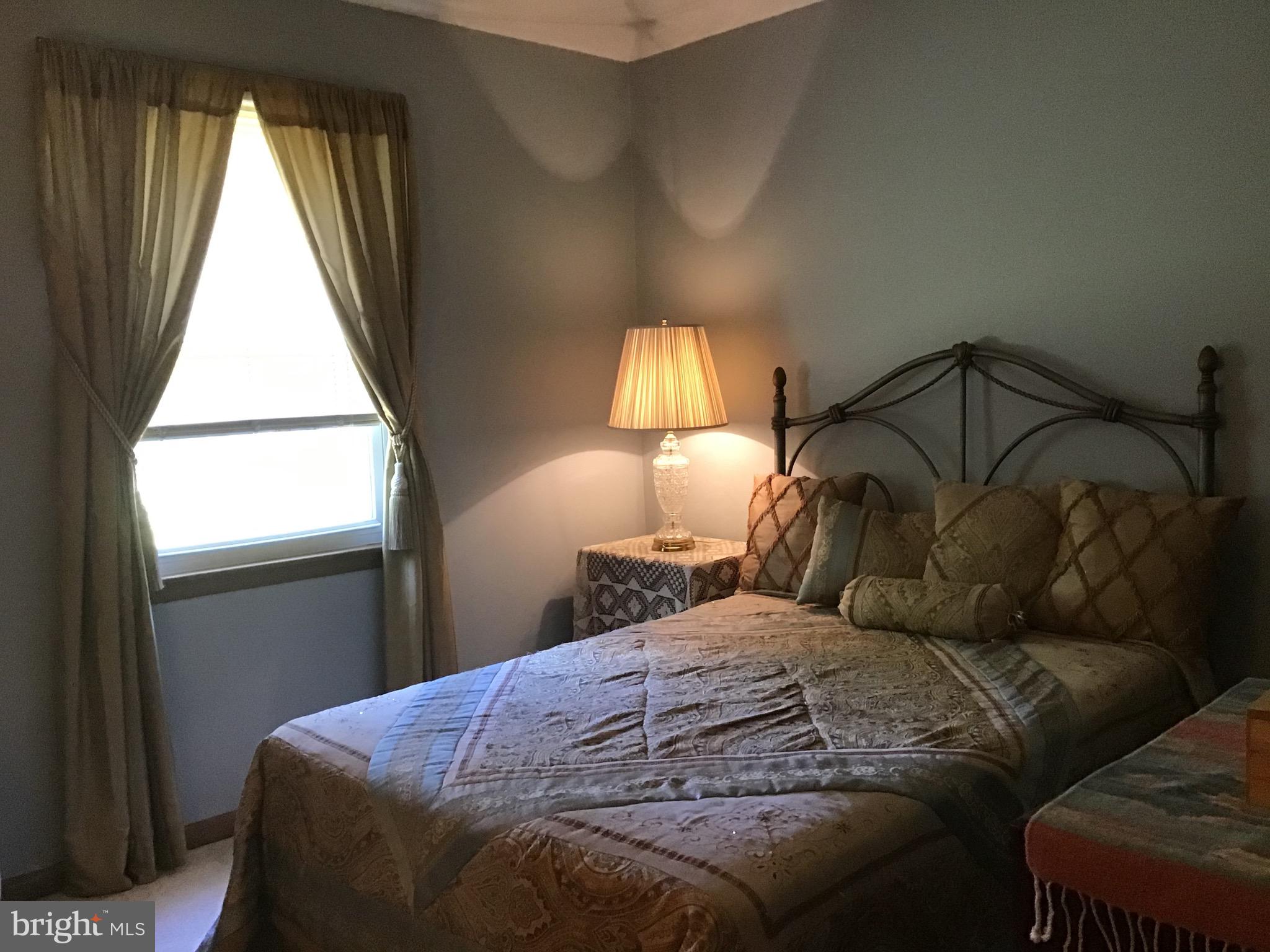 1503 Marshall Mill Road Franklinville, NJ 08322 - Photo 24 of 34 a bedroom with a bed and a window