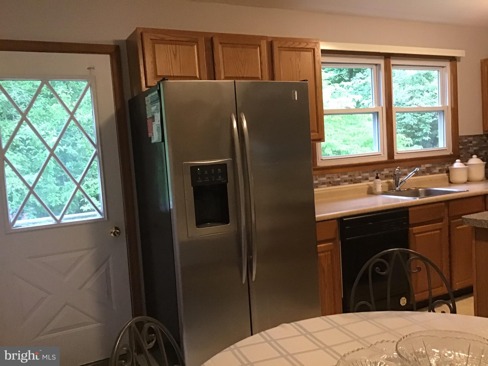 1503 Marshall Mill Road Franklinville, NJ 08322 - Photo 5 of 34 a bedroom with a bed and a dresser next to a window