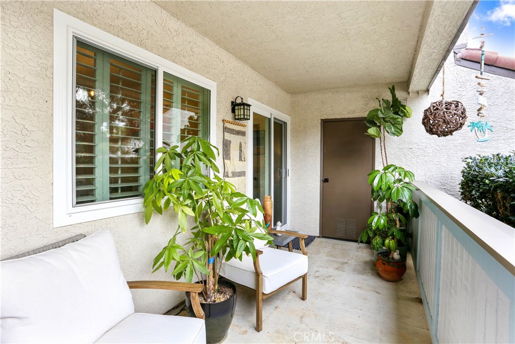 12 Corniche Drive, Unit A Dana Point, CA 92629 - Photo 13 of 26 a view of a chairs and table in a patio