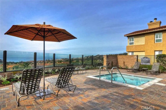 a view of a chairs and table in backyard
