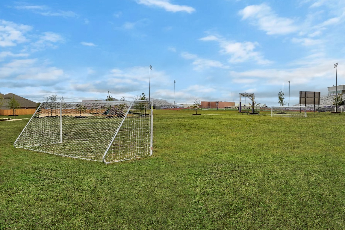 14713 Eagles Claw Way Elgin, TX 78621 - Photo 3 of 4 a view of a basket ball ground