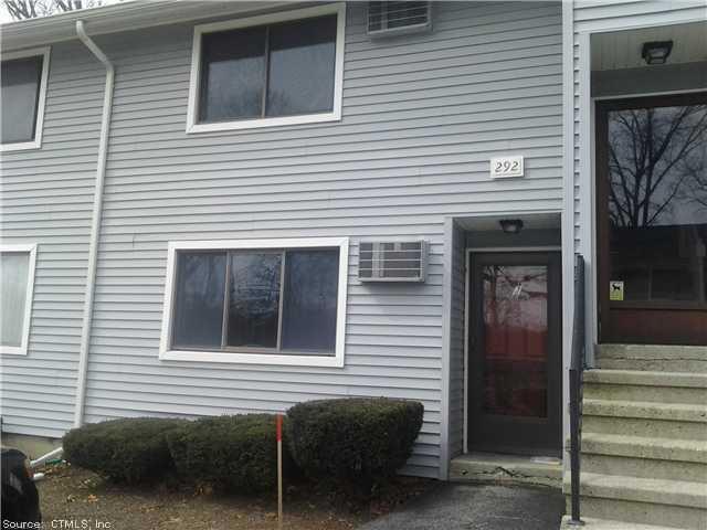 292 Meridian Street, Unit J Groton, CT 06340 - Photo 1 of 1 a view of a house that has a car parked in front of it