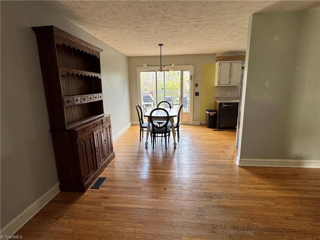 2741 River Ridge Road Pfafftown, NC 27040 - Photo 9 of 17 Viewing into Eat-in Kitchen from Living Room