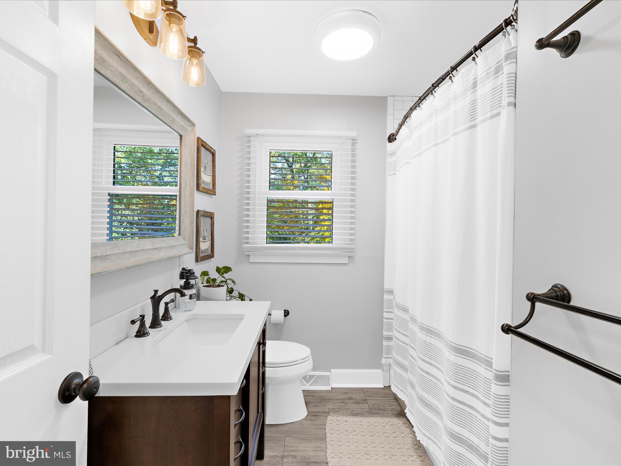 11 Barnhart Road Westminster, MD 21158 - Photo 29 of 66 a bathroom with a sink a mirror and a shower