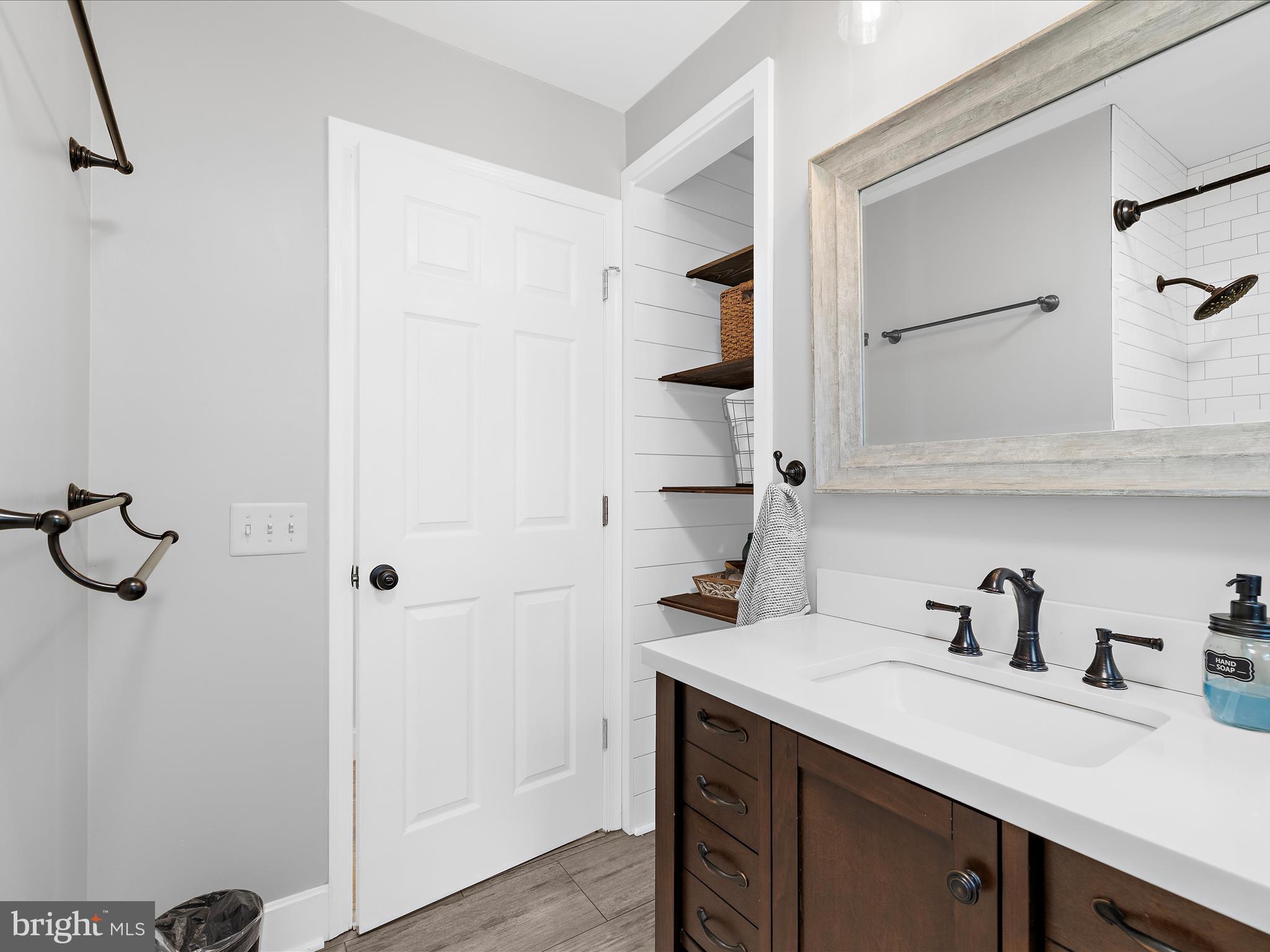 11 Barnhart Road Westminster, MD 21158 - Photo 33 of 66 a view of a bathroom with a sink and mirror