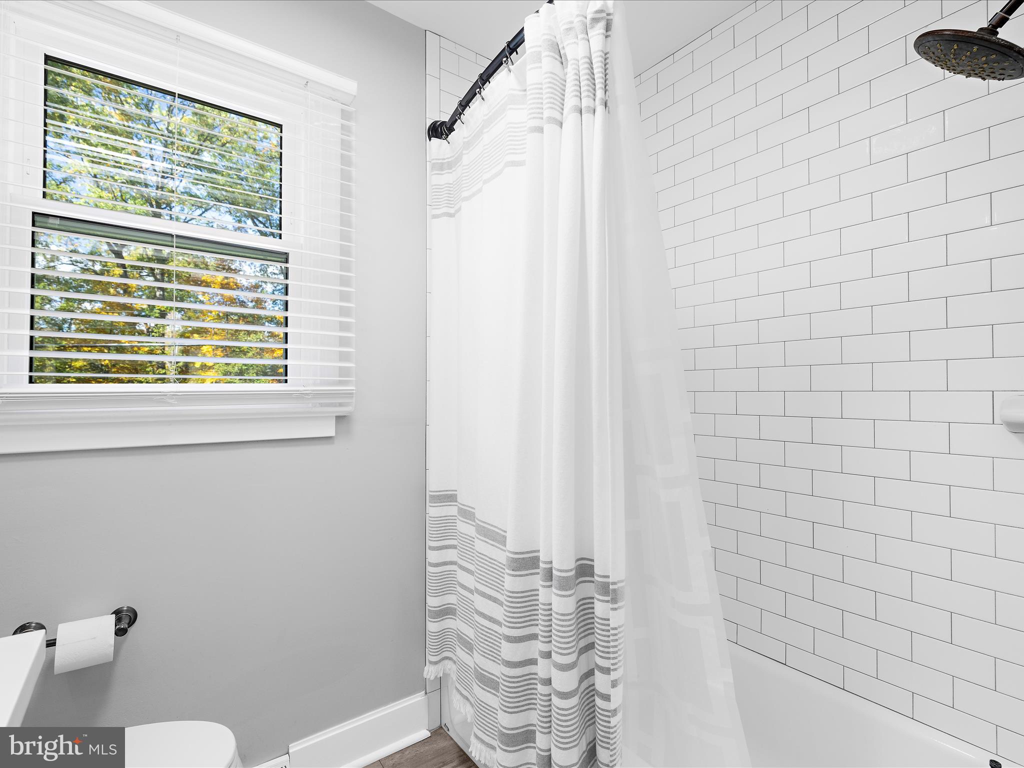 11 Barnhart Road Westminster, MD 21158 - Photo 34 of 66 a bathroom with a window and a shower curtain