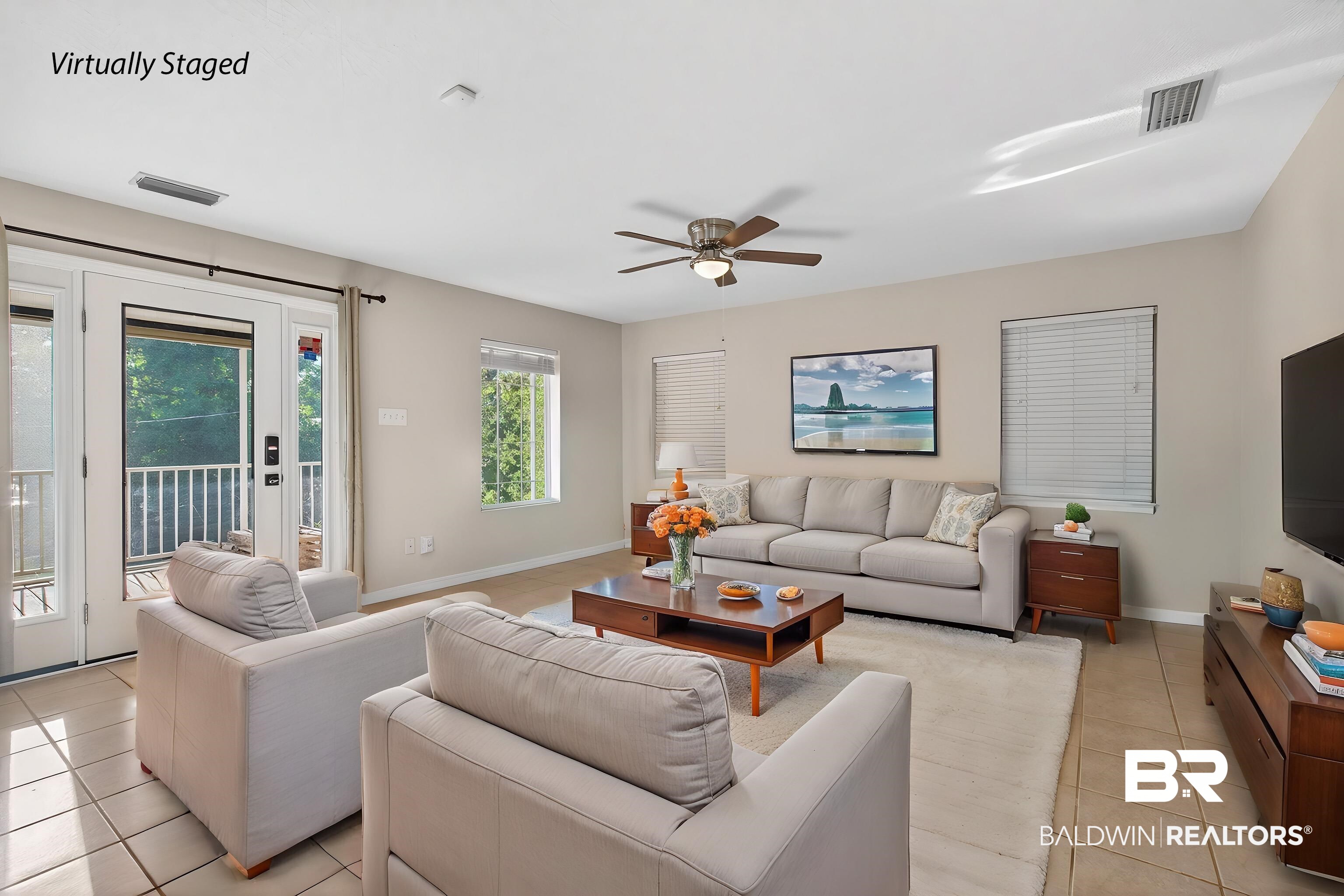 9624 North Bay Street Foley, AL 36535 - Photo 16 of 59 Spacious living area featuring neutral wall tones, tile flooring, and multiple windows