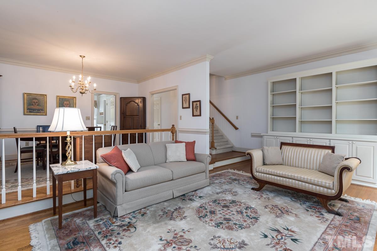 3302 Ridgecrest Court Raleigh, NC 27607 - Photo 11 of 23 a living room with furniture and a rug