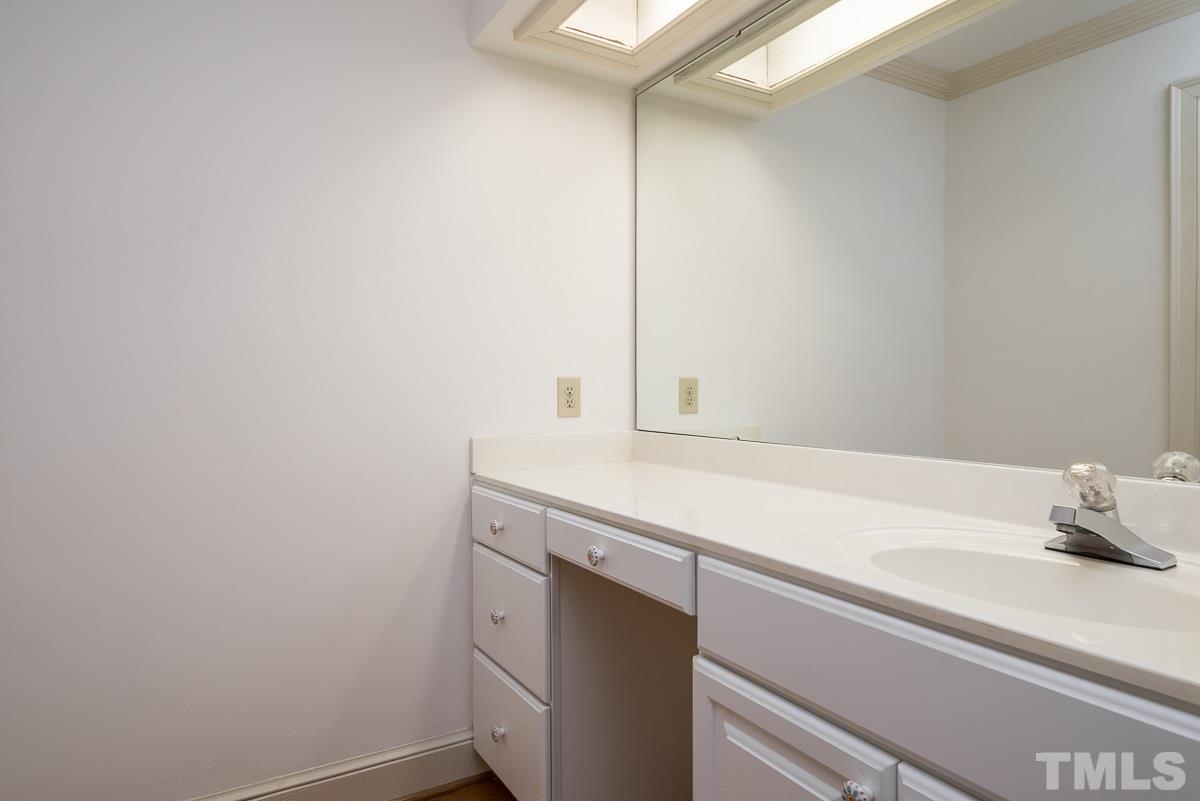 3302 Ridgecrest Court Raleigh, NC 27607 - Photo 13 of 23 a bathroom with a sink and vanity