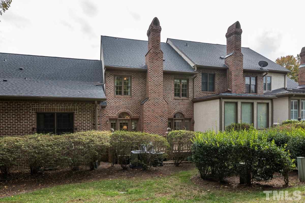 3302 Ridgecrest Court Raleigh, NC 27607 - Photo 22 of 23 a front view of a house with a garden