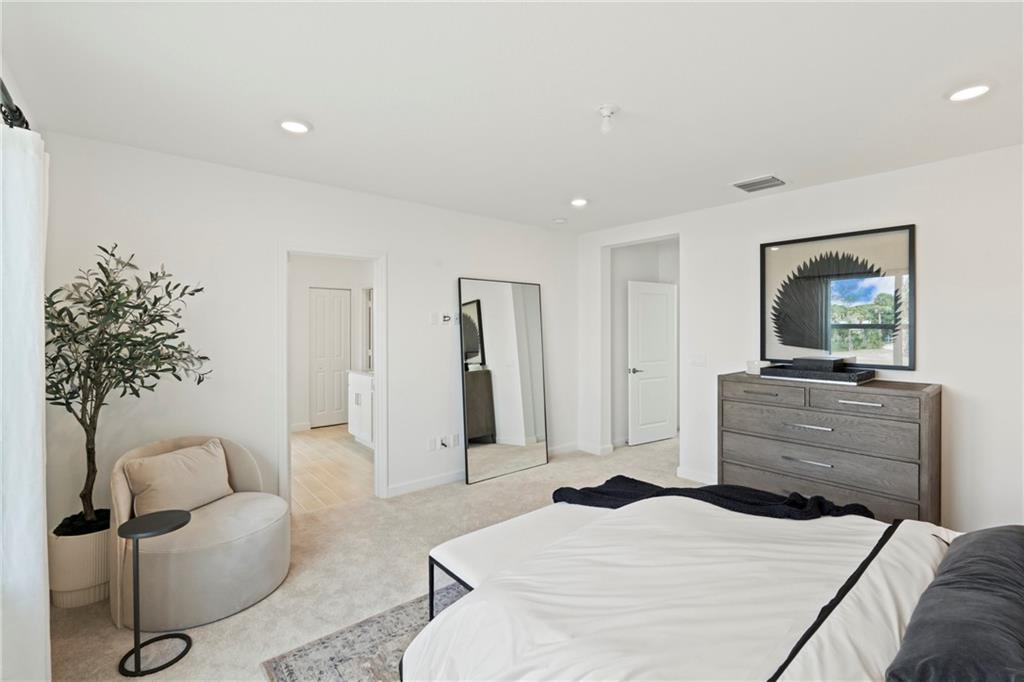 22036 Brookmont Drive Boca Raton, FL 33433 - Photo 11 of 32 a bedroom with a bed and a couch