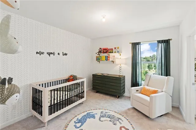 a bedroom with furniture and a window