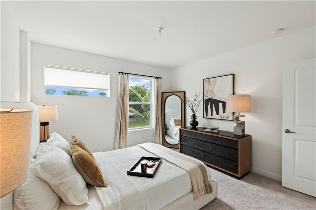 22036 Brookmont Drive Boca Raton, FL 33433 - Photo 17 of 32 a bedroom with furniture and a window