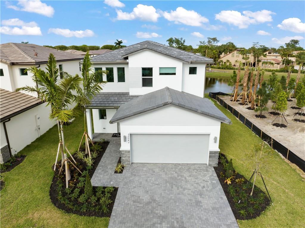 22036 Brookmont Drive Boca Raton, FL 33433 - Photo 20 of 32 a view of a house with a yard