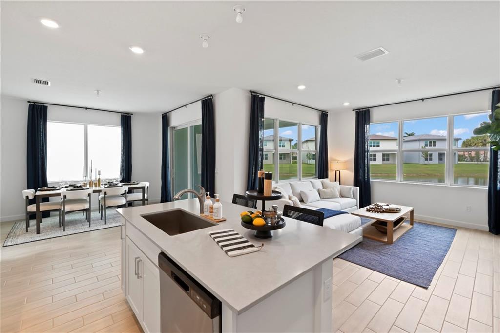 22036 Brookmont Drive Boca Raton, FL 33433 - Photo 4 of 32 a living room with furniture and large windows