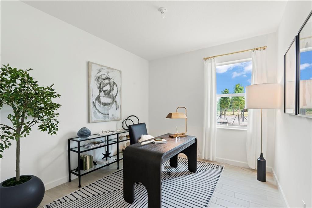 22036 Brookmont Drive Boca Raton, FL 33433 - Photo 7 of 32 a living room with furniture and a potted plant