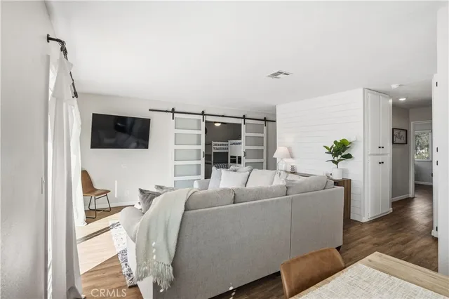 a kitchen with stainless steel appliances a sink stove and refrigerator