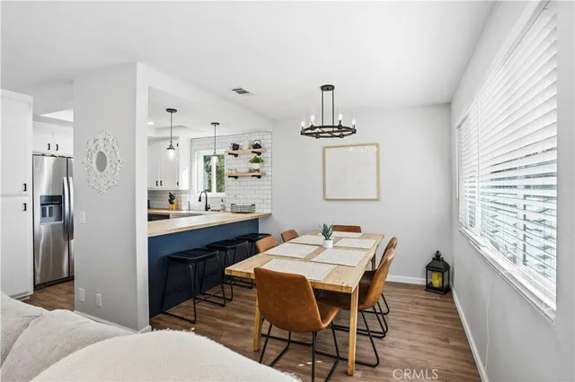 a kitchen with a sink stove and refrigerator