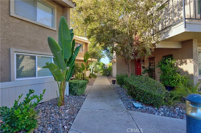 a view of a car park in front of house