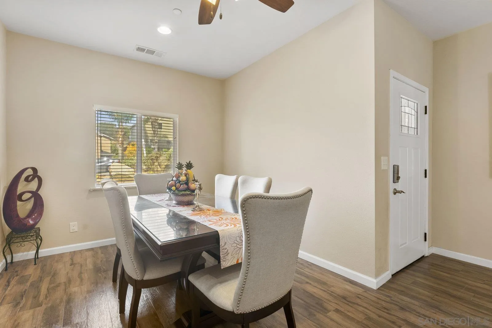 1637 Paraiso Avenue Spring Valley, CA 91977 - Photo 14 of 45 a view of a dining room with furniture window and wooden floor