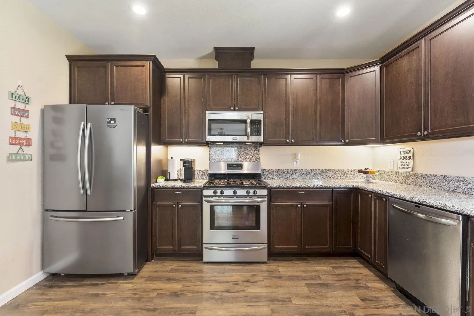1637 Paraiso Avenue Spring Valley, CA 91977 - Photo 16 of 45 a kitchen with stainless steel appliances granite countertop a refrigerator stove a sink and dishwasher