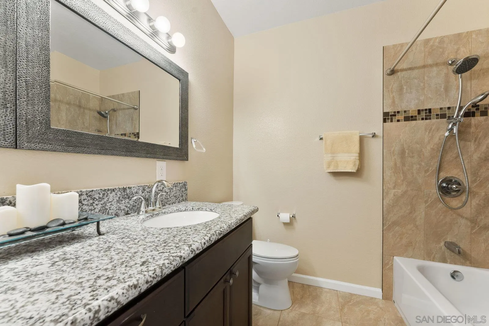 1637 Paraiso Avenue Spring Valley, CA 91977 - Photo 33 of 45 a bathroom with a granite countertop sink a toilet and bathtub