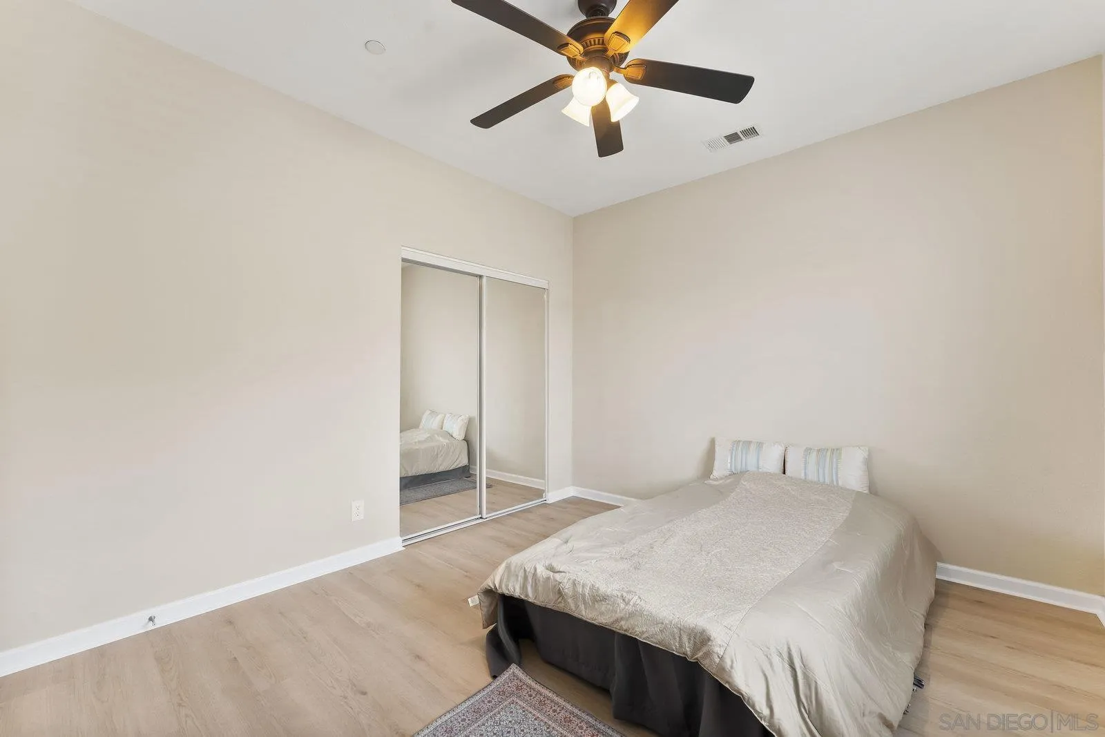 1637 Paraiso Avenue Spring Valley, CA 91977 - Photo 35 of 45 a bedroom with a bed and a ceiling fan